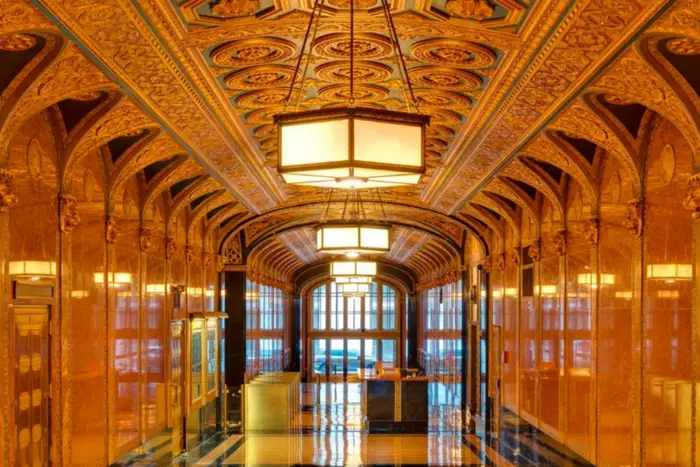 The elaborate interior of 200 Madison Avenue's lobby, which is golden